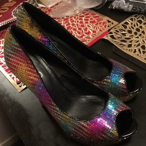 3 pair of shoes and a purse